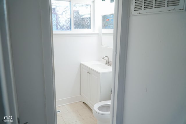 bathroom with tile patterned floors, vanity, and toilet