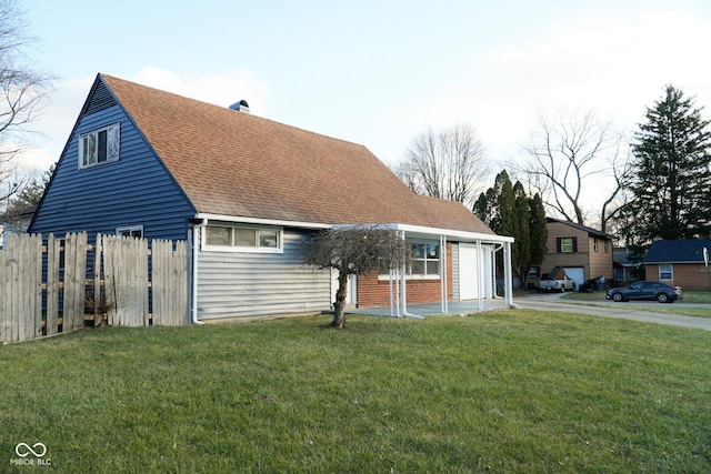 view of front of house with a garage and a front lawn