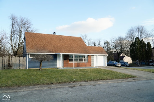 view of front facade with a garage and a front lawn