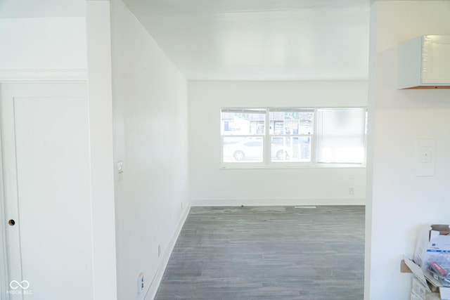 hallway with dark hardwood / wood-style floors