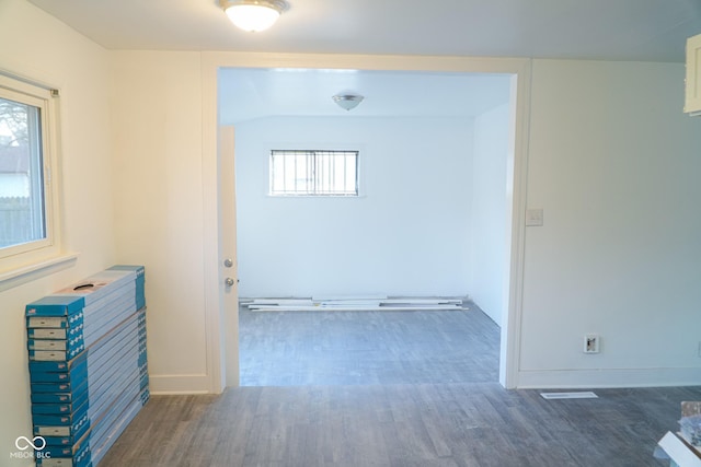 corridor featuring dark hardwood / wood-style floors