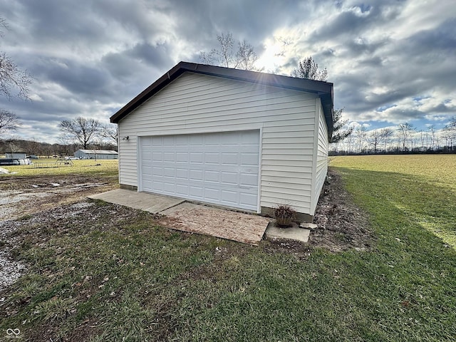 garage with a yard