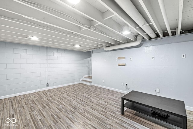 basement featuring hardwood / wood-style floors