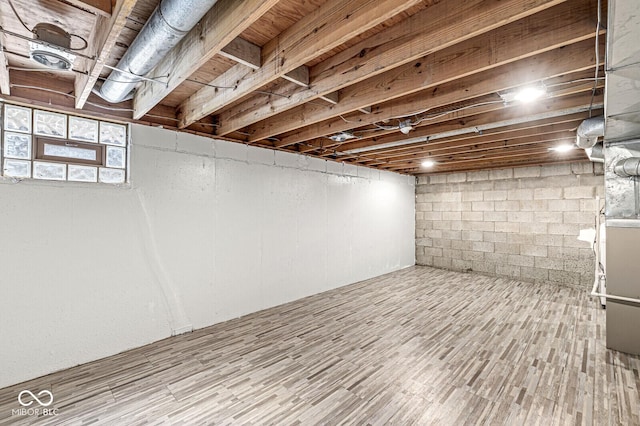 basement featuring hardwood / wood-style floors