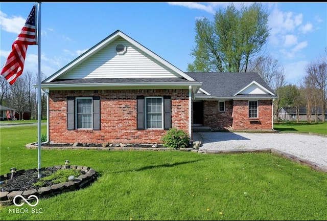 ranch-style home featuring a front yard