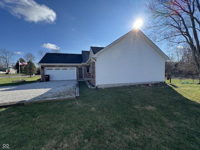 view of home's exterior featuring a yard and a garage