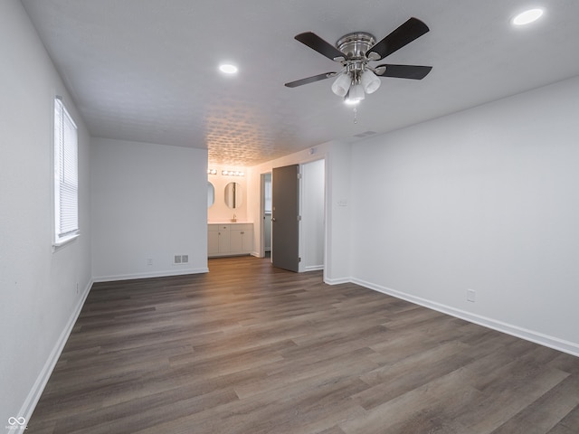 interior space featuring ceiling fan and dark hardwood / wood-style flooring