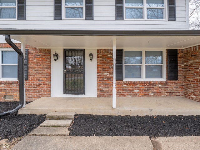 property entrance with covered porch