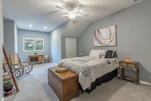 bedroom with ceiling fan, light carpet, and vaulted ceiling