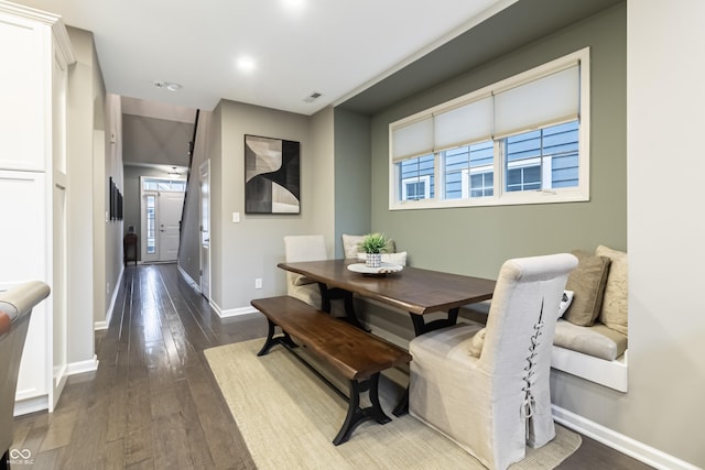 dining area featuring dark hardwood / wood-style flooring