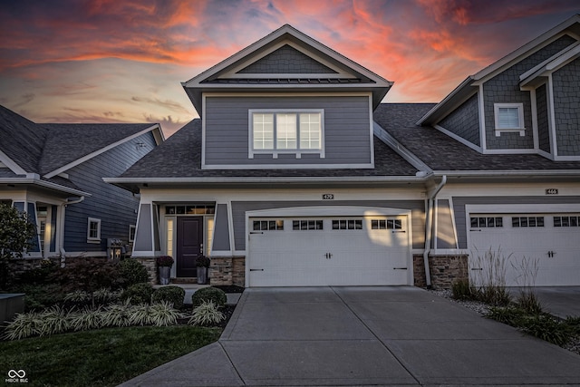 craftsman inspired home with a garage