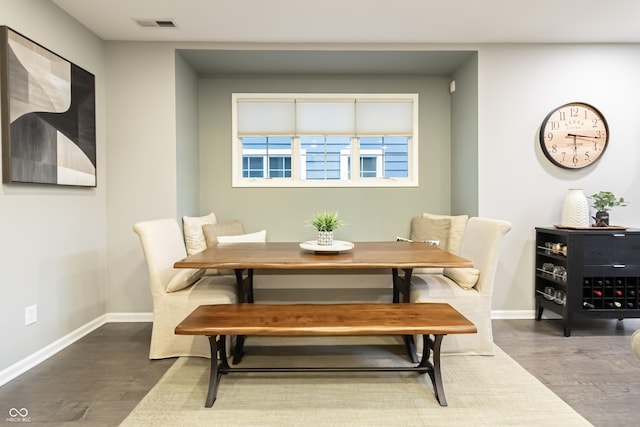 dining space featuring wood-type flooring