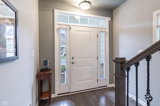 foyer with dark hardwood / wood-style flooring