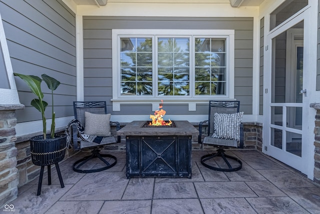 view of patio with a fire pit