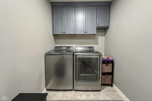 laundry area featuring cabinets and independent washer and dryer