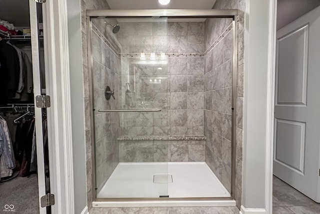 bathroom featuring tile patterned flooring and walk in shower