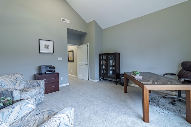 office featuring light colored carpet and lofted ceiling