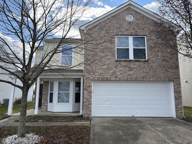 view of property featuring central AC and a garage