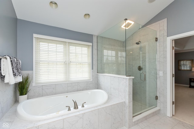 bathroom with lofted ceiling and separate shower and tub