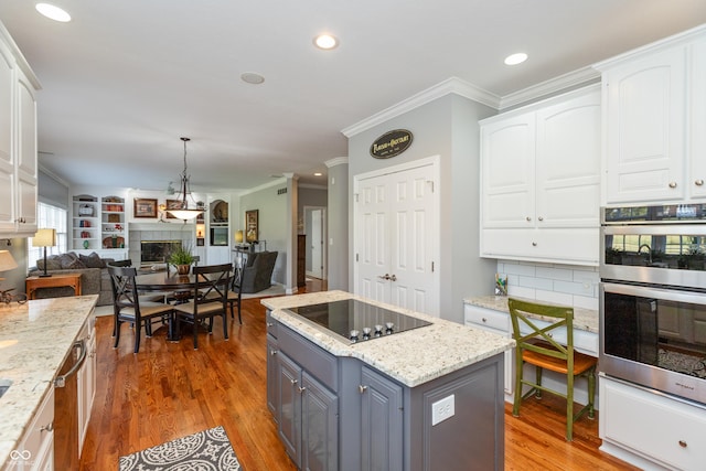 kitchen with gray cabinets, white cabinetry, and black electric stovetop