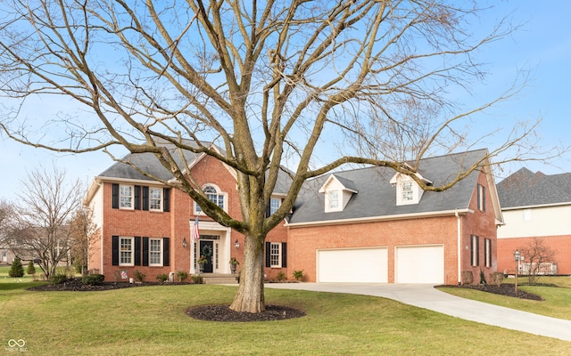 view of front of home featuring a front lawn and a garage