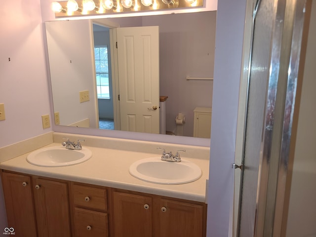 bathroom featuring vanity and toilet