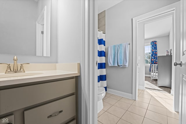 full bathroom featuring vanity, a shower with shower curtain, baseboards, tile patterned flooring, and toilet