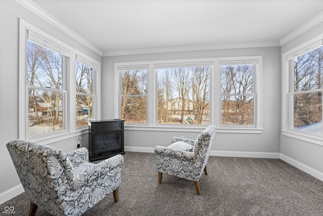 sitting room with crown molding, baseboards, and carpet floors