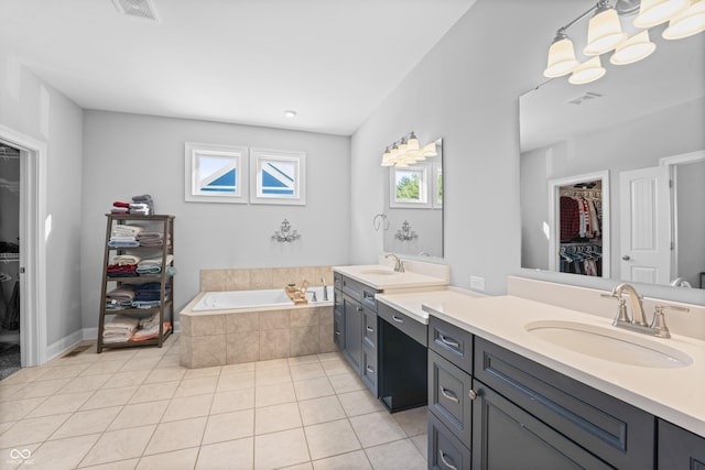 full bath with tile patterned floors, visible vents, a bath, and vanity