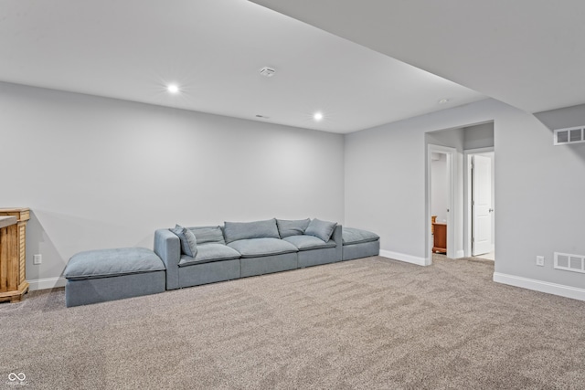 carpeted living area featuring visible vents, recessed lighting, and baseboards