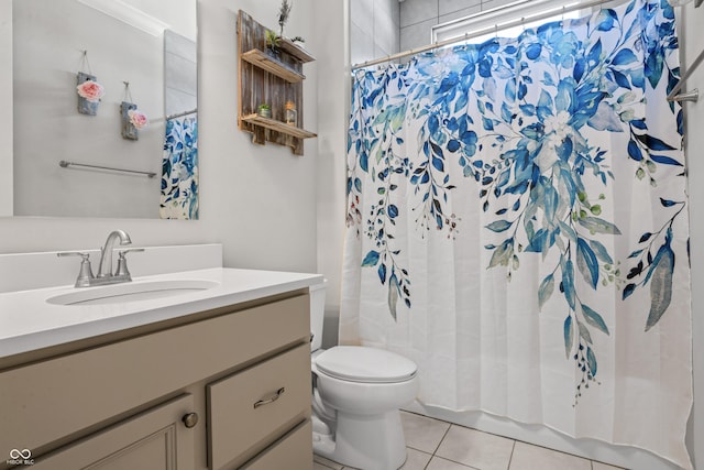 bathroom featuring a shower with curtain, tile patterned flooring, vanity, and toilet