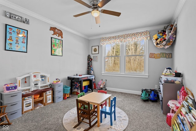 game room with carpet, ceiling fan, and ornamental molding