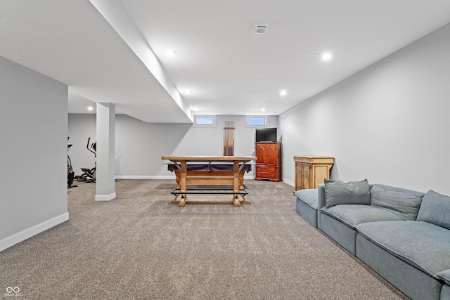 living room featuring recessed lighting, baseboards, and carpet floors