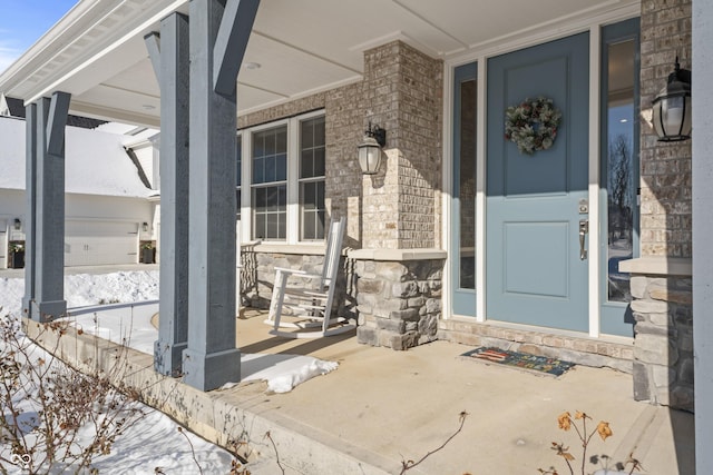 view of exterior entry featuring a porch