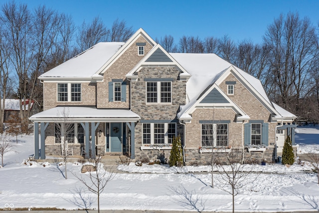 craftsman-style home with stone siding and covered porch