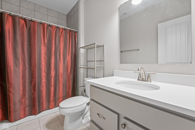 bathroom with tile patterned flooring, toilet, vanity, and a shower with curtain