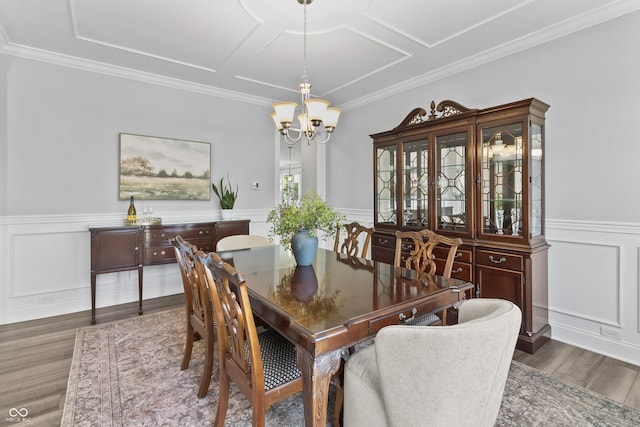 78 Chatham Brook Dr, Westfield, IN 46074 - dining area featuring wood finished floors, a chandelier, wainscoting, ornamental molding, and a decorative wall