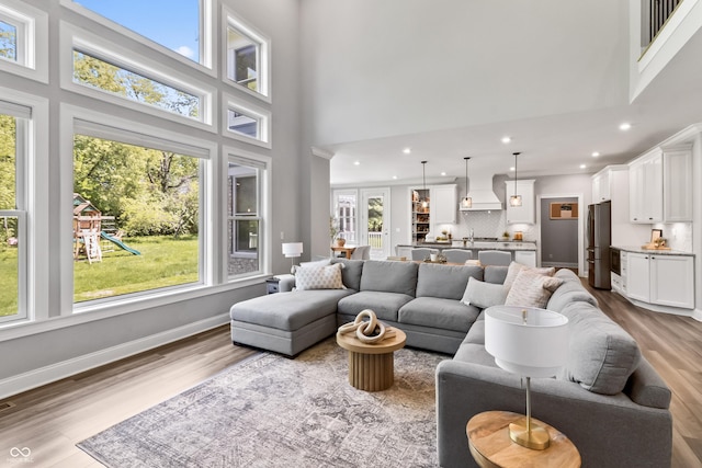 78 Chatham Brook Dr, Westfield, IN 46074 - living area featuring a high ceiling, wood finished floors, recessed lighting, and baseboards
