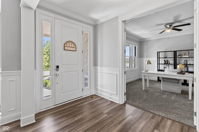 78 Chatham Brook Dr, Westfield, IN 46074 - entrance foyer with dark wood-style flooring, a decorative wall, ceiling fan, crown molding, and wainscoting
