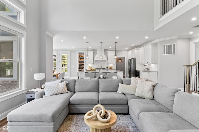 78 Chatham Brook Dr, Westfield, IN 46074 - living room with a towering ceiling, recessed lighting, stairs, ornamental molding, and baseboards