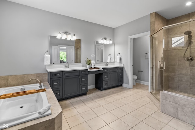 78 Chatham Brook Dr, Westfield, IN 46074 - full bathroom featuring a shower stall, toilet, a garden tub, tile patterned flooring, and vanity