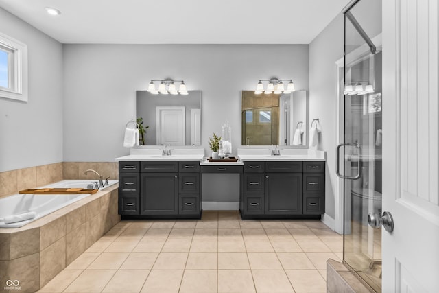 78 Chatham Brook Dr, Westfield, IN 46074 - full bath featuring a stall shower, a garden tub, tile patterned floors, and two vanities