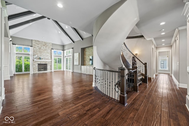 hallway featuring dark hardwood / wood-style flooring and lofted ceiling with beams