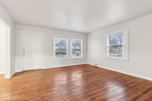 empty room featuring hardwood / wood-style floors