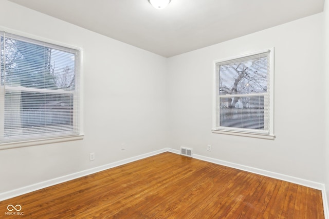 unfurnished room featuring wood-type flooring