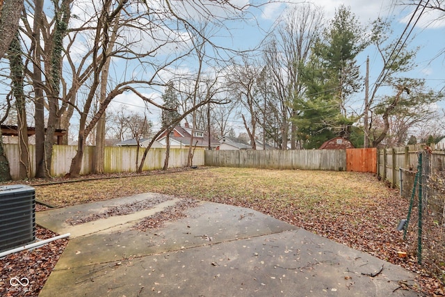 view of yard featuring central AC unit and a patio area