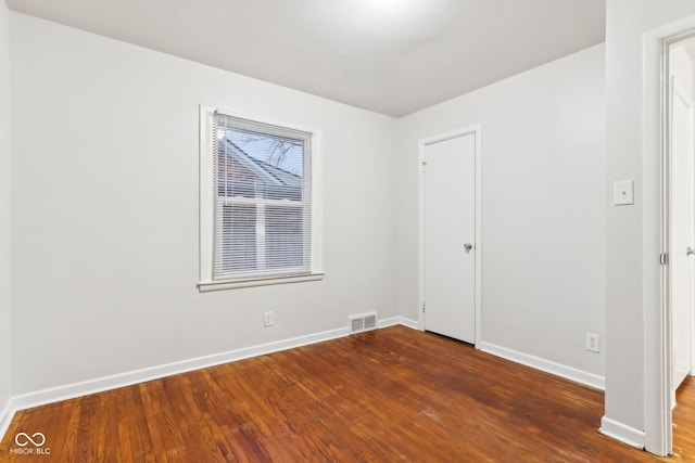 empty room featuring dark hardwood / wood-style floors