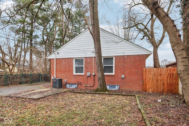 rear view of house with central AC