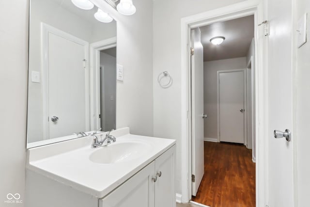 bathroom featuring vanity and hardwood / wood-style floors