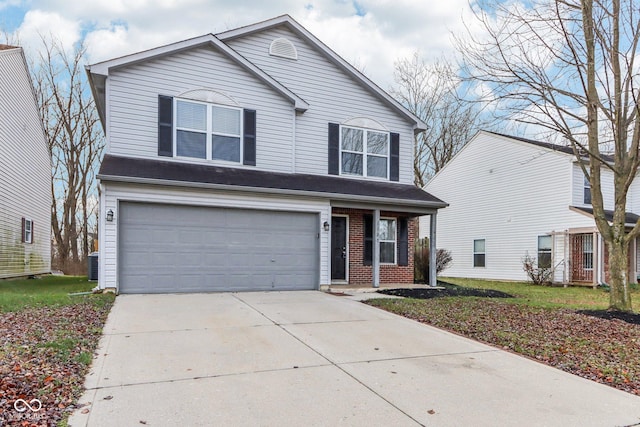 view of property featuring central AC and a garage